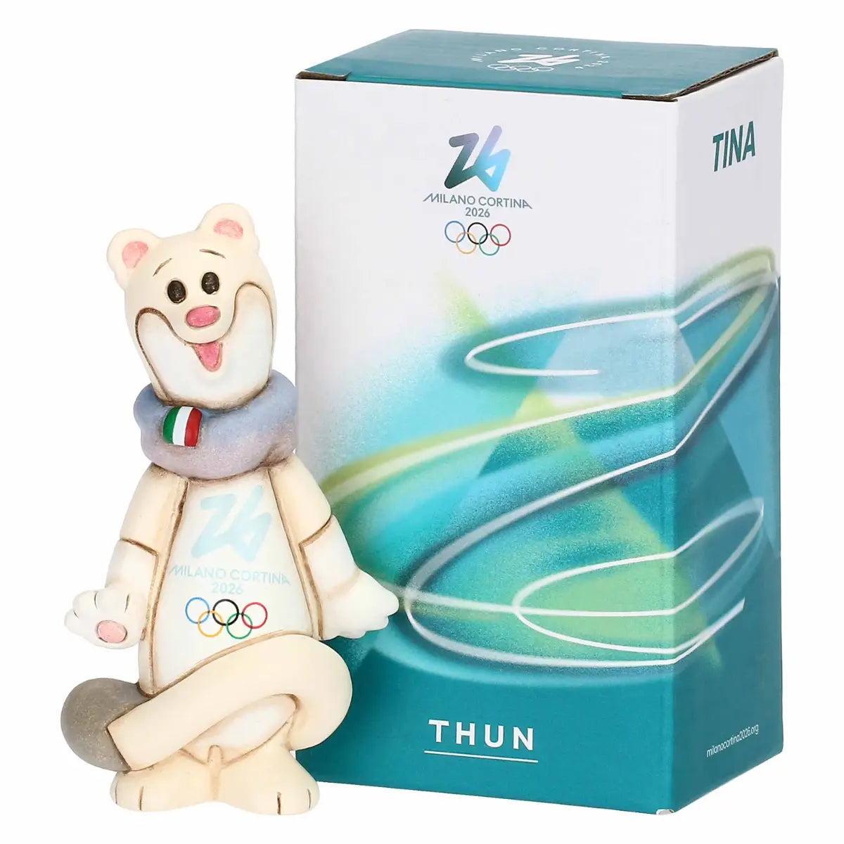Confezione ufficiale della mascotte Tina THUN. La scatola bianca e azzurra riporta i loghi di Milano Cortina 2026 e il nome "TINA", accanto alla statuina in ceramica.