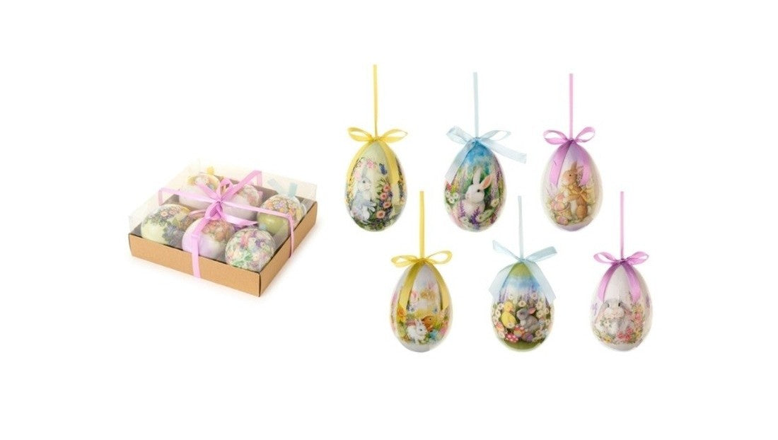 Set da 6 uova decorative della collezione "Dorothy" di Nuvole di Stoffa, ideali come addobbi pasquali da appendere o come abbellimento per l'albero di Pasqua. Ogni uovo presenta illustrazioni a tema primaverile con coniglietti e fiori in tonalità pastello, completato da un nastrino colorato e presentato in una scatola regalo in cartoncino con fiocco rosa.