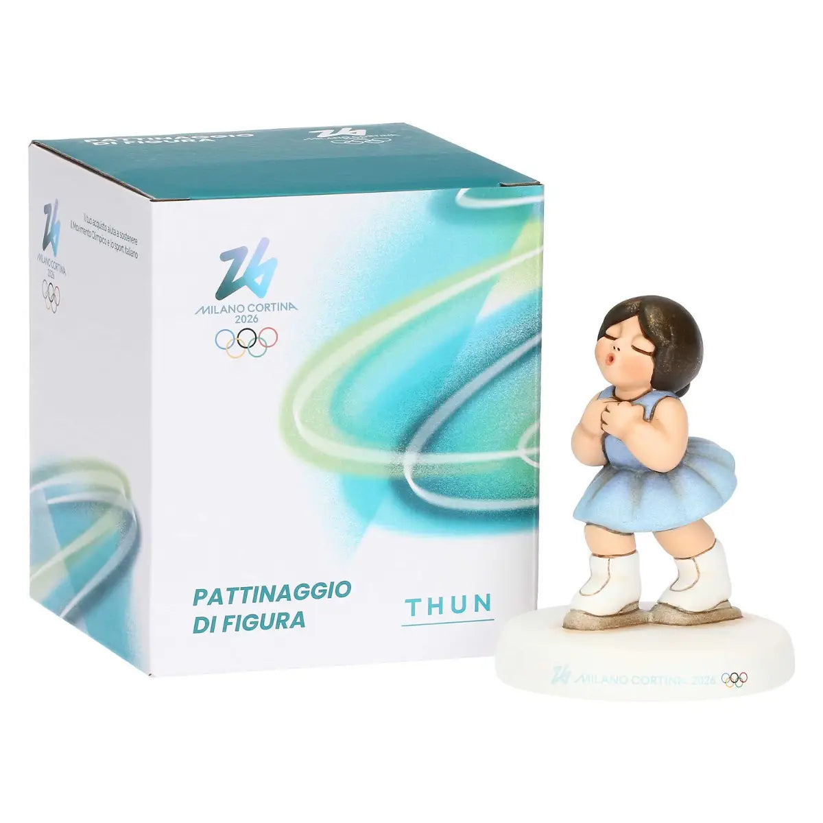 Statuina della pattinatrice accanto alla scatola ufficiale THUN "Pattinaggio di Figura", con loghi ufficiali Milano Cortina 2026 e grafiche dinamiche.