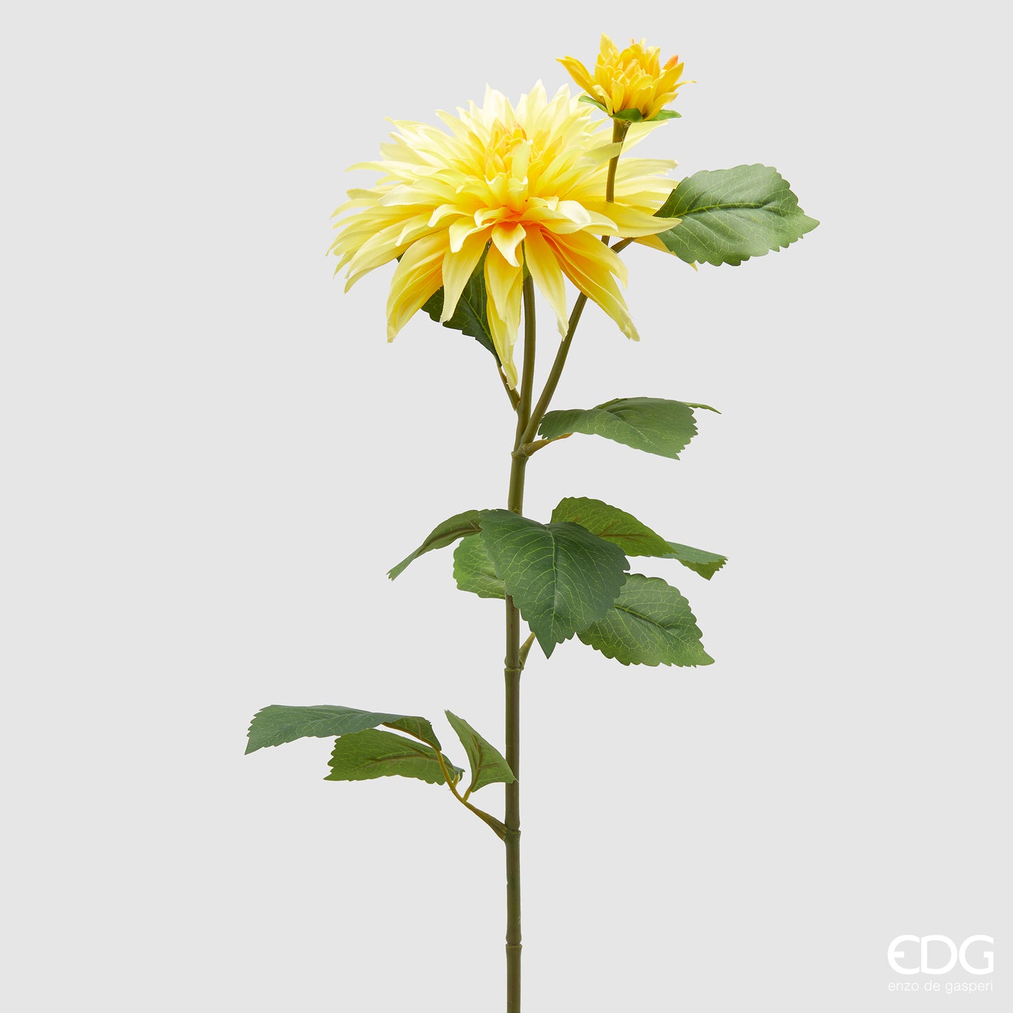 Ramo artificiale di Dalia EDG Enzo de Gasperi con foglie variegate verde scuro e fiore giallo. Fogliame e fiore realistici dal design slanciato, ideale per composizioni floreali e vasi d'arredo.