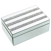 Portagioie rettangolare in vetro specchiato con coperchio attraversato da tre fasce parallele interamente incastonate di brillantini trasparenti sfaccettati. Scatola portagioie elegante firmata E-Camacho, ideale come oggetto d'arredo glamour o idea regalo raffinata.