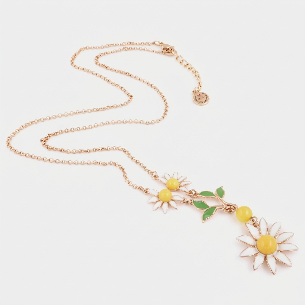 Collana BySimon della collezione Etna in oro rosa con pendente a cascata composto da margherite smaltate bianche, foglie verdi e una perla gialla.