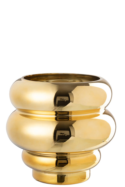 Portacandela e vaso decorativo modello Clea dorato con finitura metallica lucida a effetto specchio, caratterizzato da un design moderno e bombato a cerchi sovrapposti. Questo elegante complemento d'arredo per interni presenta una struttura sagomata a onde, ideale come centrotavola di design o vaso per fiori per arricchire la casa.