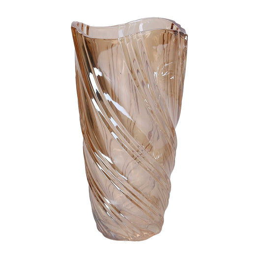 Vaso in vetro artistico di colore ambra trasparente del marchio Vacchetti, caratterizzato da una superficie lavorata con motivi a onda a spirale e bordo superiore irregolare e sinuoso.