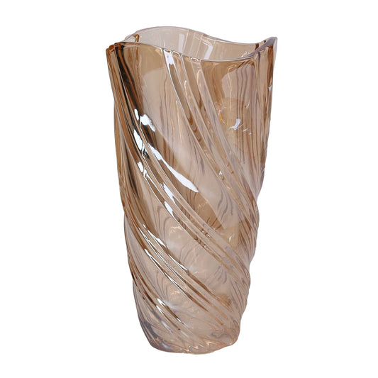 Vaso in vetro artistico di colore ambra trasparente del marchio Vacchetti, caratterizzato da una superficie lavorata con motivi a onda a spirale e bordo superiore irregolare e sinuoso.