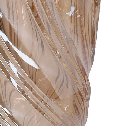 Vaso in vetro artistico di colore ambra trasparente del marchio Vacchetti, caratterizzato da una superficie lavorata con motivi a onda a spirale e bordo superiore irregolare e sinuoso.
