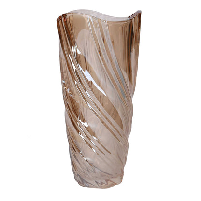 Vaso in vetro artistico di colore ambra trasparente del marchio Vacchetti, caratterizzato da una superficie lavorata con motivi a onda a spirale e bordo superiore irregolare e sinuoso.