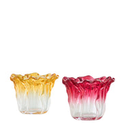 Porta t-light in vetro dal bordo ondulato e frastagliato, con sfumatura colorata assortita tra giallo ambra e rosso rubino. Portacandela decorativo dalla forma irregolare, ideale per l'home décor e come idea regalo.