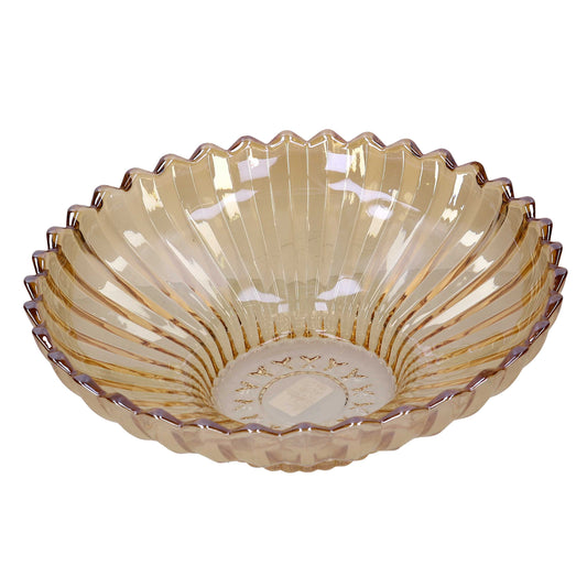 Ciotola tonda centrotavola in vetro ambra con pareti scanalate a raggiera, bordo ondulato e base decorata a rilievo.