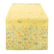 Runner da tavola giallo della "Easter Collection" di Blanc Mariclo' caratterizzato da una vivace stampa primaverile con pulcini, uova decorate e rami fioriti. Questo tessuto ornamentale è perfetto per apparecchiare la tavola di Pasqua con uno stile country chic gioioso e ricercato.