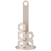 Portarotolo verticale in metallo color tortora con base circolare traforata a motivi floreali e asta centrale, mostrato vuoto e con un rotolo di carta inserito.