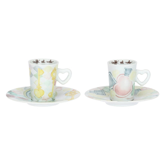Tazzine in porcellana Thun collezione Incanto di Primavera. Design con motivo a rombi azzurro e bianco decorato con icone di chiavi dorate a forma di cuore e cuori pastello. Scritta interna "caffè al volo".