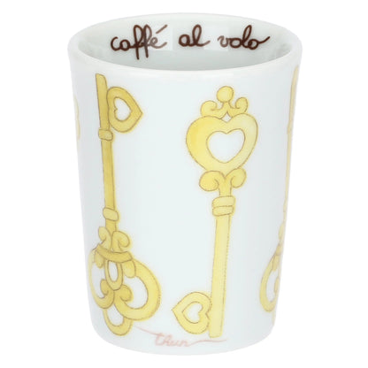 Caffeini in porcellana Thun collezione Incanto di Primavera. Design con motivo a rombi azzurro e bianco decorato con icone di chiavi dorate a forma di cuore e cuori pastello. Scritta interna "caffè al volo".