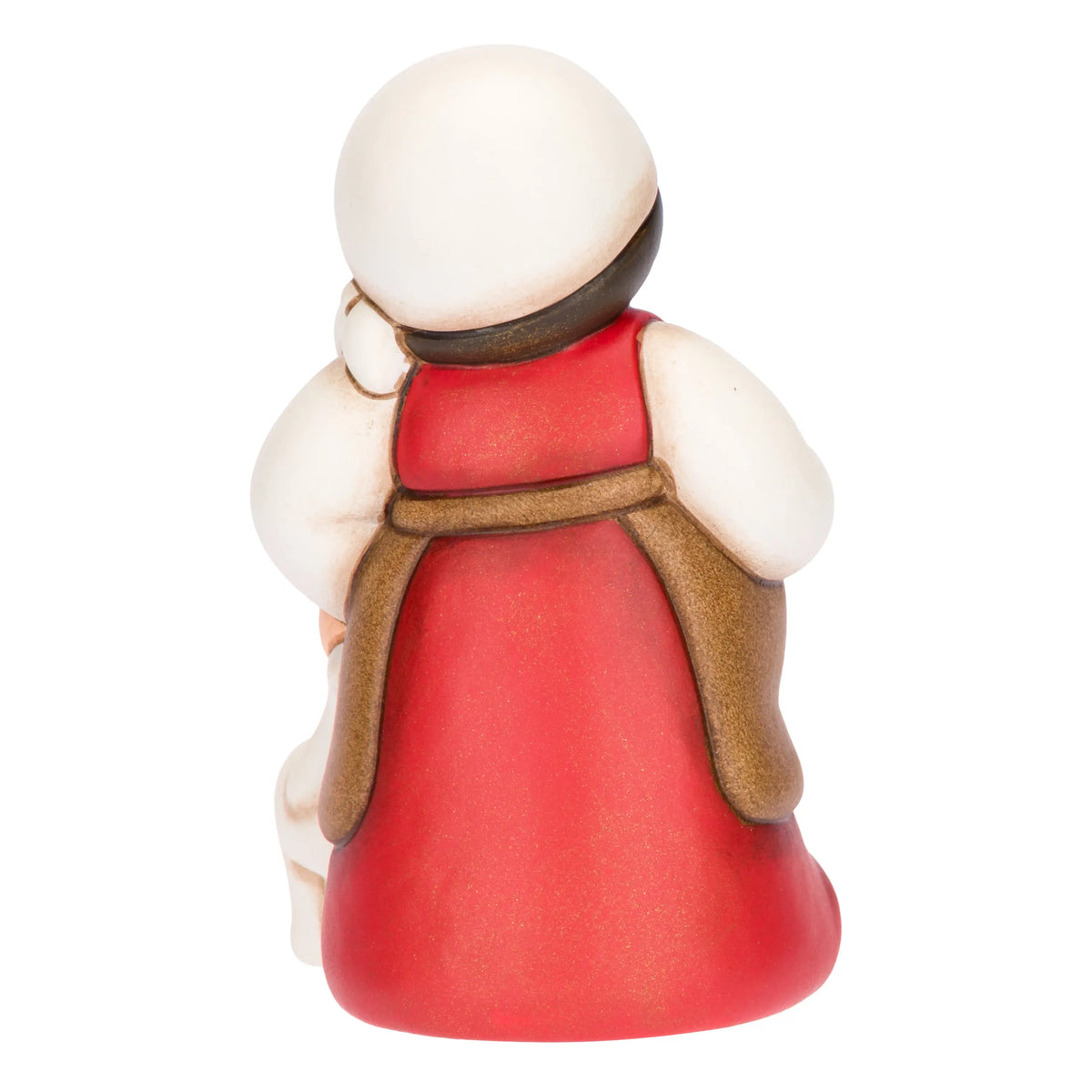 Statuina in ceramica raffigurante una pastorella del presepe in dolce attesa, con lunghi capelli scuri, veste rossa e mantello marrone, accanto a un agnellino bianco. Personaggio dal design classico e curato firmato THUN, ideale per arricchire il presepe o come idea regalo natalizia.