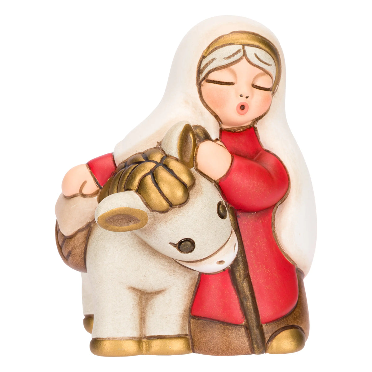 Statuina in ceramica raffigurante una donna del presepe con velo bianco e veste rossa, che accompagna un asinello con basto dorato appoggiando la mano sulla sua testa. Personaggio dal design classico e curato firmato THUN, ideale per arricchire il presepe o come idea regalo natalizia.