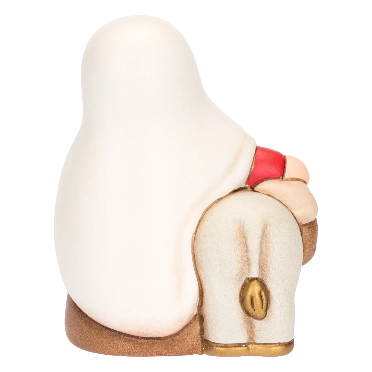 Statuina in ceramica raffigurante una donna del presepe con velo bianco e veste rossa, che accompagna un asinello con basto dorato appoggiando la mano sulla sua testa. Personaggio dal design classico e curato firmato THUN, ideale per arricchire il presepe o come idea regalo natalizia.