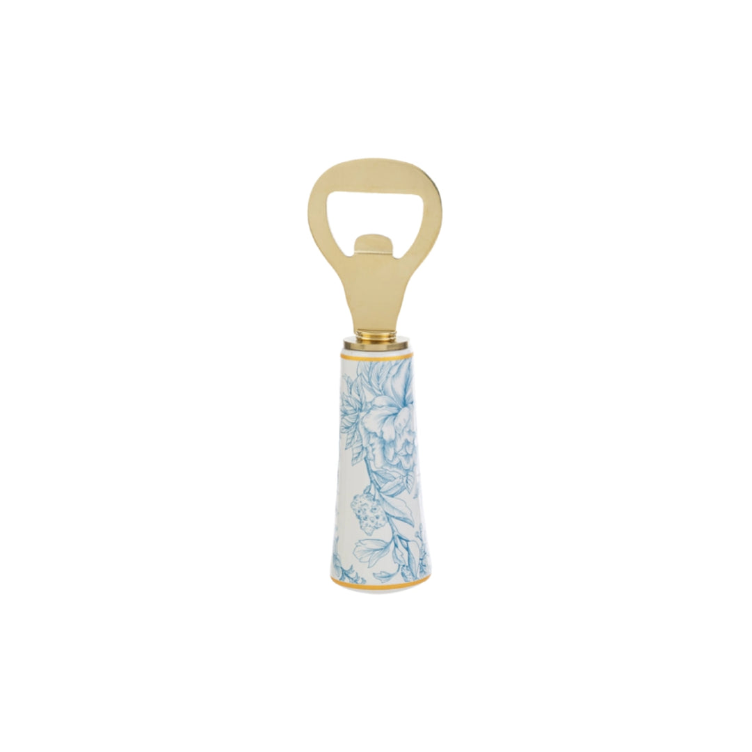 Apribottiglie con decoro azzurro firmato Le Stelle, caratterizzato da una solida testa in metallo color oro e un elegante manico in porcellana bianca decorato con delicati motivi floreali azzurri. Questo raffinato utensile da cucina e bar di design è accompagnato dalla sua custodia regalo rettangolare coordinata con la stessa fantasia botanica, perfetto come bomboniera di classe o idea regalo home decor.