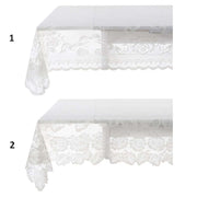 Tovaglia in pizzo bianco della collezione "Dentelle" di Blanc Mariclo' adatta per impreziosire la tavola con uno stile shabby chic ed elegante. Il dettaglio mostra due varianti assortite di tovaglie ricamate con motivi floreali e bordi smerlati ideali per la cucina o il soggiorno.