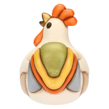 Cachepot in ceramica Thun a forma di gallo della collezione Incanto di Pasqua. Il contenitore presenta il corpo color crema, cresta e bargigli arancioni e una coda variopinta nei toni del verde, giallo, arancio e grigio azzurro. Design cavo sul dorso ideale come porta-piantina o svuotatasche pasquale.