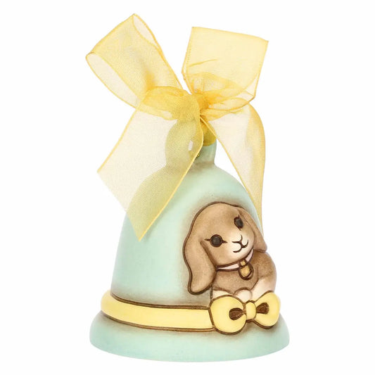 Campanella pasquale Thun in ceramica azzurra, Limited Edition 2026 della collezione Incanto di Pasqua. La campanella è decorata con il coniglio Roger in rilievo, un nastro giallo dipinto alla base e un grande fiocco verde in organza sulla sommità. Design iconico Thun con colori sfumati per l'arredo casa di Pasqua.