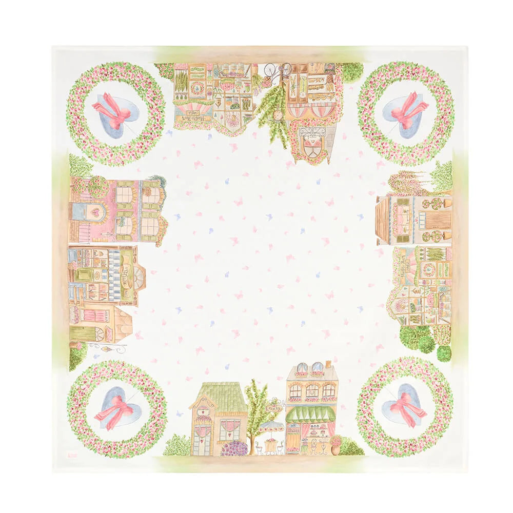 Centrotavola Nuvole di Stoffa linea "La Vie en Rose" con illustrazioni di negozi parigini e pasticcerie vintage. Decorazione con ghirlande di rose, cuori azzurri con fiocchi rosa e farfalle su fondo bianco.