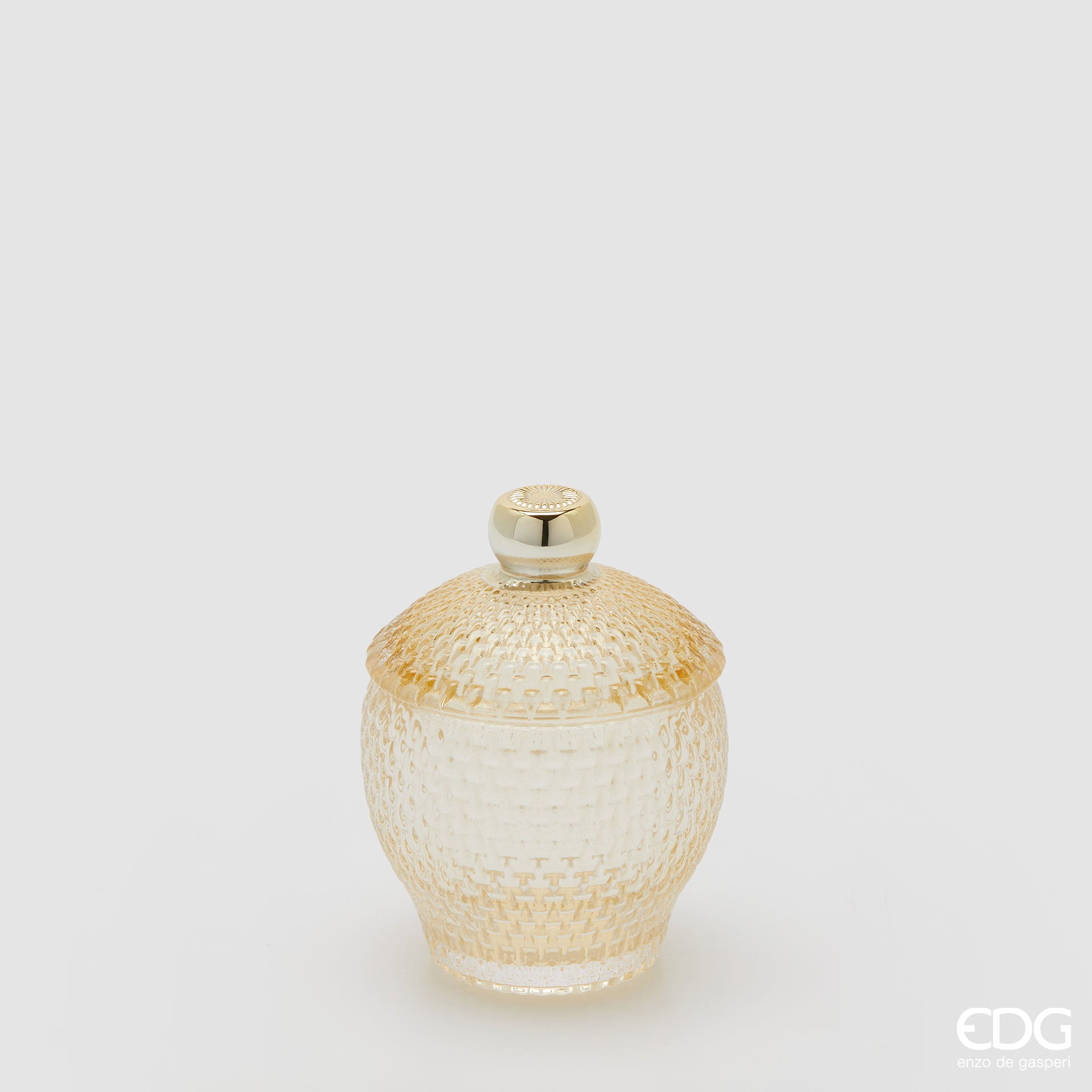 Contenitore decorativo EDG Enzo de Gasperi in vetro giallo lavorato con trama a rilievo. Design bombato con coperchio coordinato e pomello dorato, ideale come portaoggetti o elemento d'arredo.