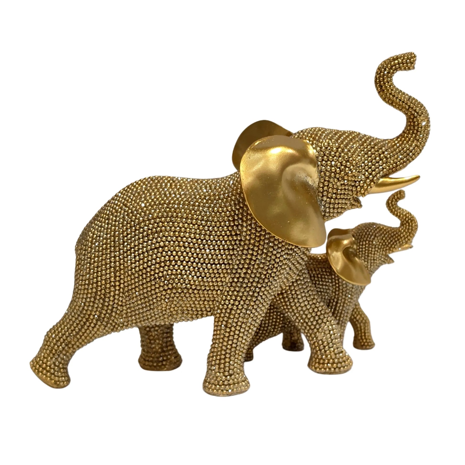 Statuina in resina raffigurante una coppia di elefanti dorati con proboscide sollevata, interamente ricoperti di brillantini glitterati e con grandi orecchie lisce a effetto metallico. Oggetto decorativo scintillante firmato Sud Import, ideale come soprammobile portafortuna o idea regalo per la casa.