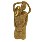 Statuina in resina raffigurante una coppia di innamorati abbracciati, con teste stilizzate lisce e corpi interamente ricoperti di brillantini glitterati dall'effetto scintillante. Oggetto decorativo firmato Sud Import, ideale come soprammobile romantico o idea regalo per San Valentino e anniversari.