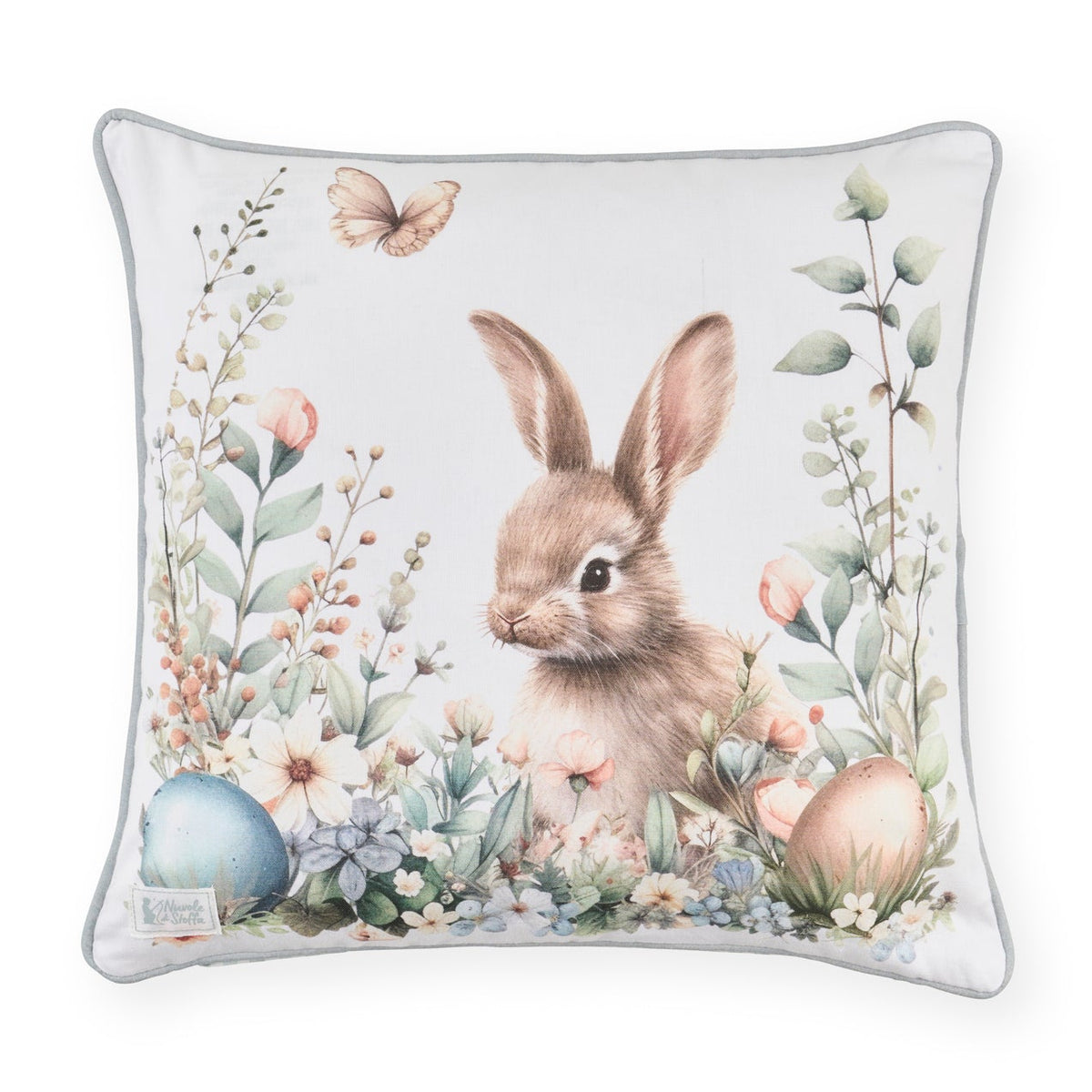 Stampa frontale del cuscino pasquale Nuvole di Stoffa in cotone. Decorazione con illustrazioni di coniglietti, uova colorate e fiori delicati. Elegante tessile per Pasqua 2026.