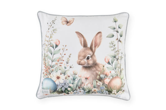 Stampa frontale del cuscino pasquale Nuvole di Stoffa in cotone. Decorazione con illustrazioni di coniglietti, uova colorate e fiori delicati. Elegante tessile per Pasqua 2026.