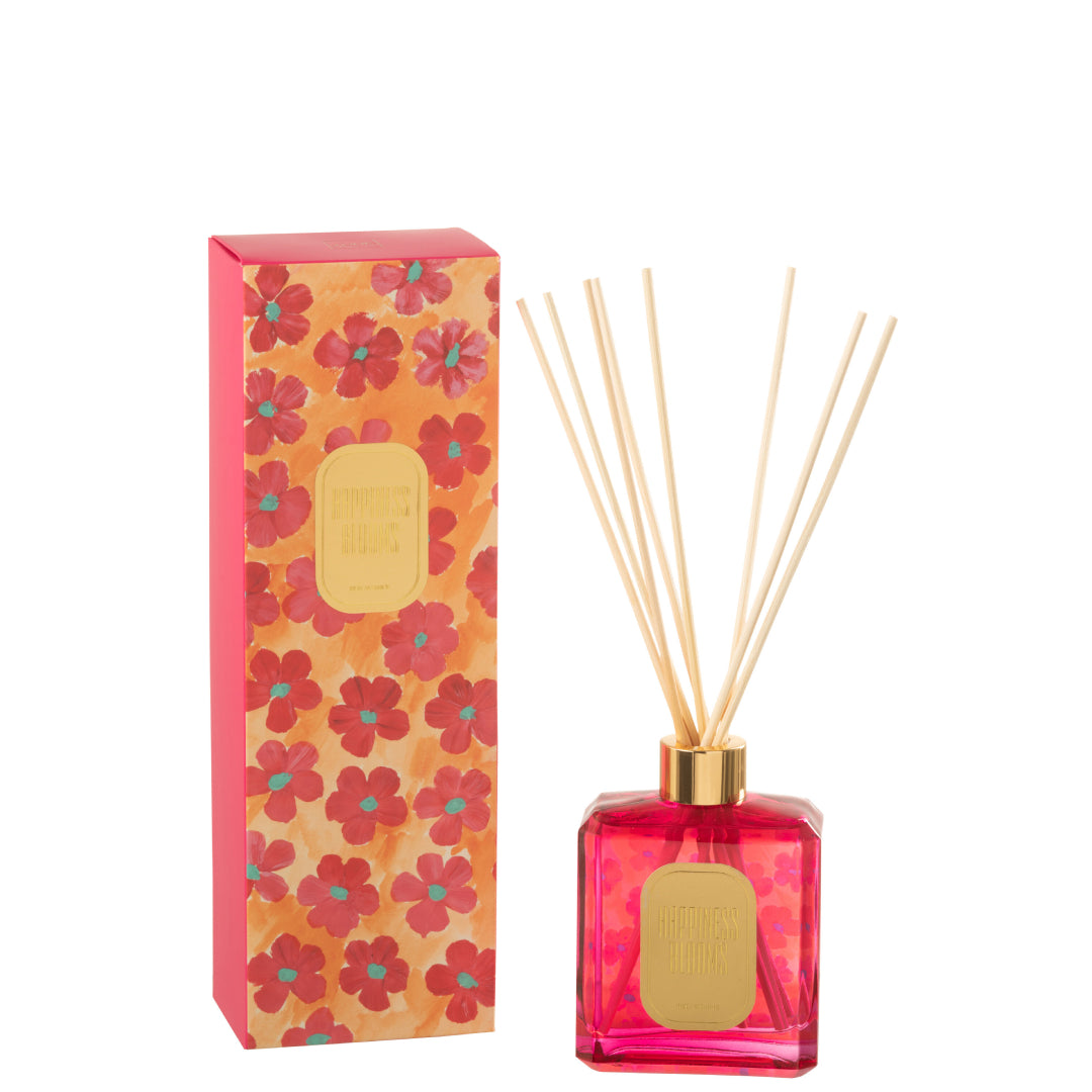 Il Diffusore per Ambienti "Happiness Blooms" Arancione Jolipa è un set di profumazione per la casa vibrante e passionale, che infonde energia e calore all'ambiente. Il flacone in vetro trasparente, riempito con una fragranza dalle intense sfumature rosa acceso/fucsia, mostra sul retro un motivo floreale dallo stile pop ed è rifinito con una lucida ghiera metallica color oro e bastoncini in legno chiaro. Una raffinata targhetta dorata frontale impreziosisce il corpo della boccetta.