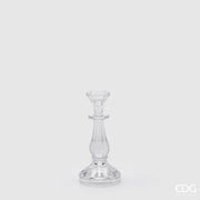 Candelabro in vetro trasparente modello Crystal piccolo firmato EDG Enzo de Gasperi, caratterizzato da un'elegante struttura classica con fusto sinuoso e scanalature verticali riflettenti. Questo raffinato portacandele di design presenta una base circolare lavorata, ideale come centrotavola decorativo per illuminare e impreziosire gli ambienti di casa.
