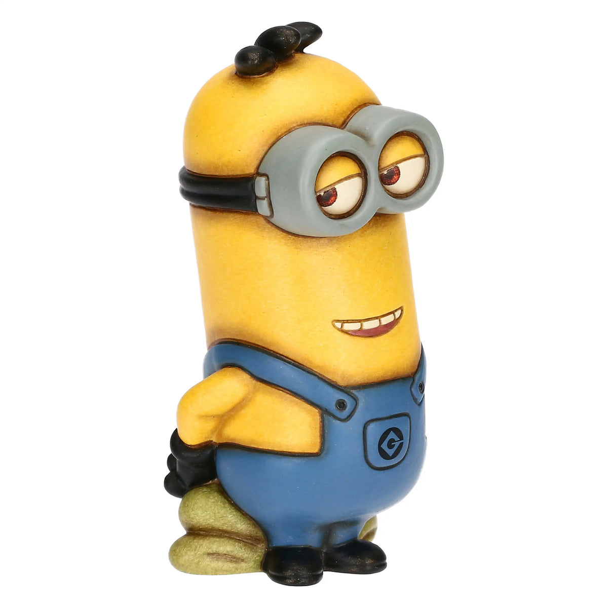 Statuina in ceramica Thun raffigurante il Minion Kevin in edizione limitata. Il personaggio è rappresentato con la tipica finitura materica Thun, indossa la classica salopette blu con logo "G" e presenta un'espressione divertita. Un pezzo da collezione raro che unisce lo stile iconico Thun all'universo Illumination.