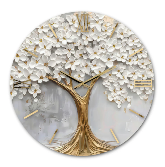 Orologio da parete circolare "Quercia" di Artidea. Il quadrante presenta un design artistico in rilievo raffigurante un albero stilizzato (quercia) con il tronco e i rami in tonalità oro metallizzato. La chioma è composta da numerosi fiori bianchi tridimensionali che creano un effetto materico e rigoglioso. Gli indici in numeri romani e le lancette sottili sono realizzati in metallo dorato lucido.