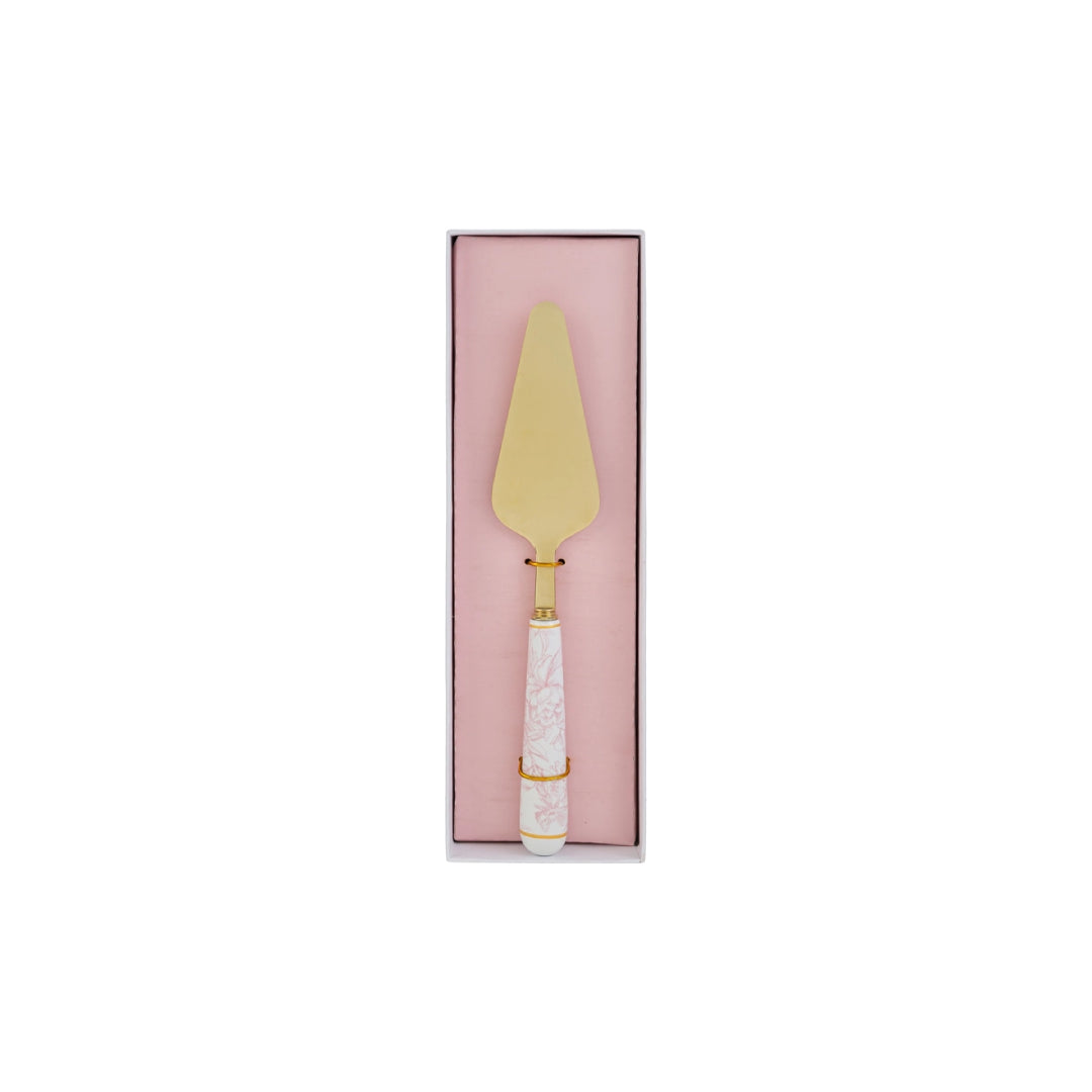 Paletta per torta con decoro rosa firmata Le Stelle, caratterizzata da una lama triangolare in metallo color oro e un elegante manico in porcellana bianca decorato con delicati motivi floreali rosati. Questo raffinato utensile da servire per dolci è accompagnato dalla sua custodia regalo rettangolare coordinata con la stessa fantasia floreale, ideale come bomboniera o come accessorio di classe per arricchire la tavola durante occasioni speciali.