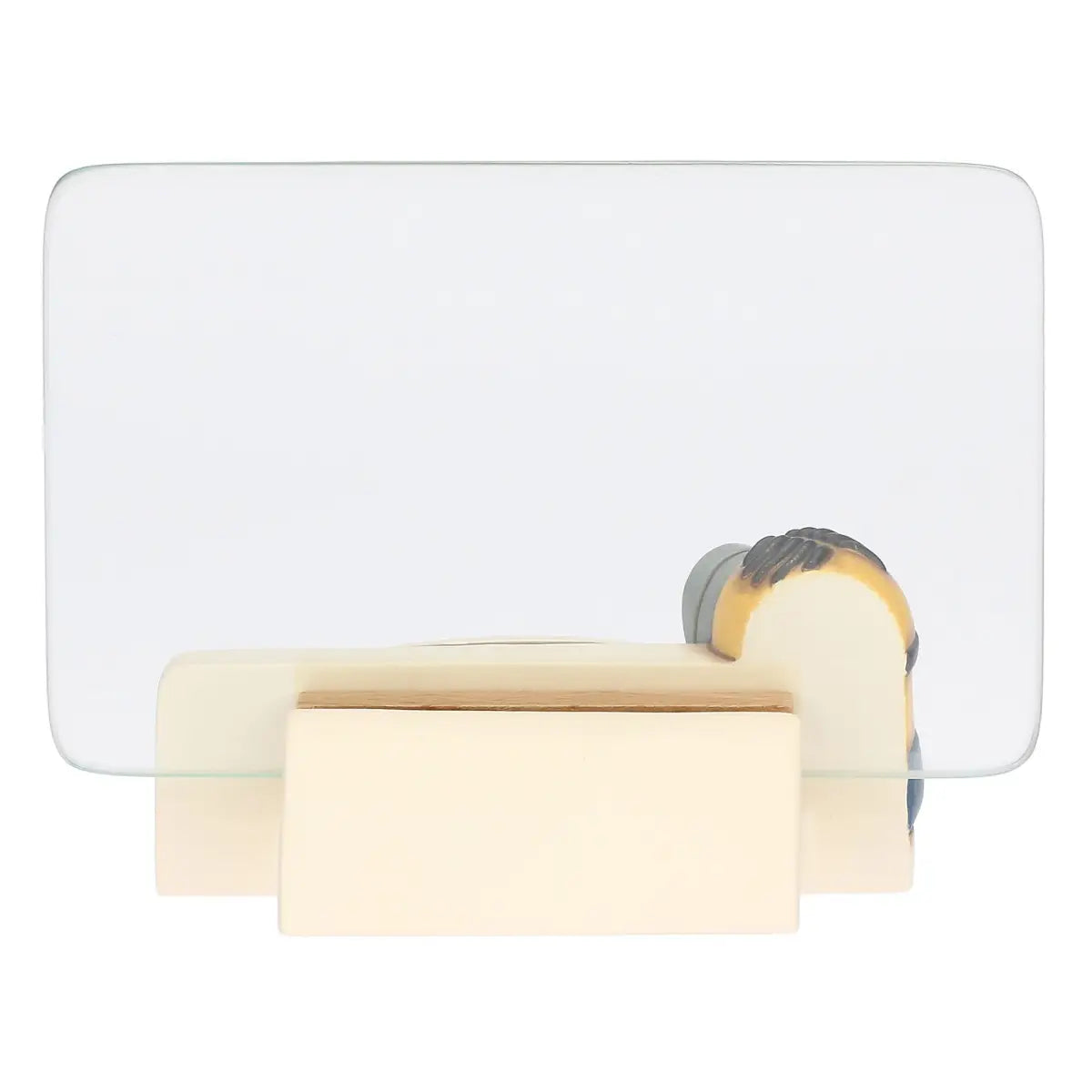 Cornice portafoto in ceramica Thun con personaggio Minion in rilievo. La base della cornice presenta un Minion con salopette azzurra intento a scrivere su una pergamena bianca, affiancato da due palloncini colorati. Design iconico Thun applicato al mondo dei Minions, ideale per camerette o come idea regalo originale.