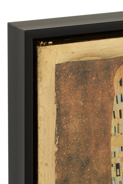 Quadro decorativo con cornice nera firmato Jolipa, che riproduce la celebre opera "Il Bacio" di Gustav Klimt impreziosita da luminosi dettagli in foglia oro. Questa raffinata stampa artistica da parete unisce l'eleganza classica del capolavoro a uno stile moderno e lussuoso, ideale per valorizzare l'arredamento del soggiorno, della camera da letto o dell'ufficio.