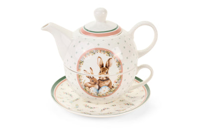 Dolce set Nuvole di Stoffa linea PePen con teiera, tazza e piattino in porcellana. Decorazione pasquale con ghirlanda di coniglietti, uova colorate e fiori di campo. Confezione regalo inclusa, stile shabby chic.