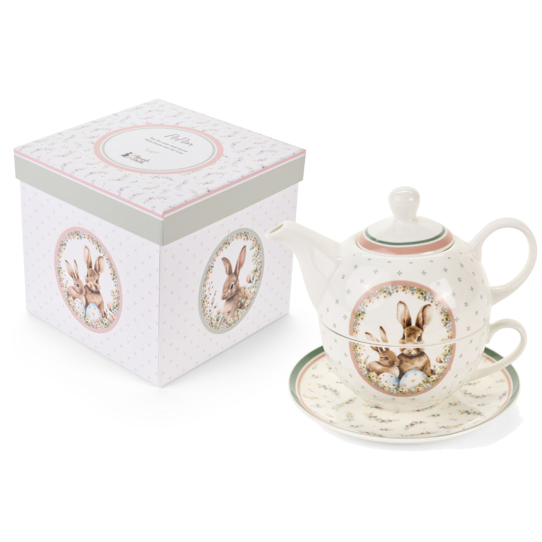 Dolce set Nuvole di Stoffa linea PePen con teiera, tazza e piattino in porcellana. Decorazione pasquale con ghirlanda di coniglietti, uova colorate e fiori di campo. Confezione regalo inclusa, stile shabby chic.