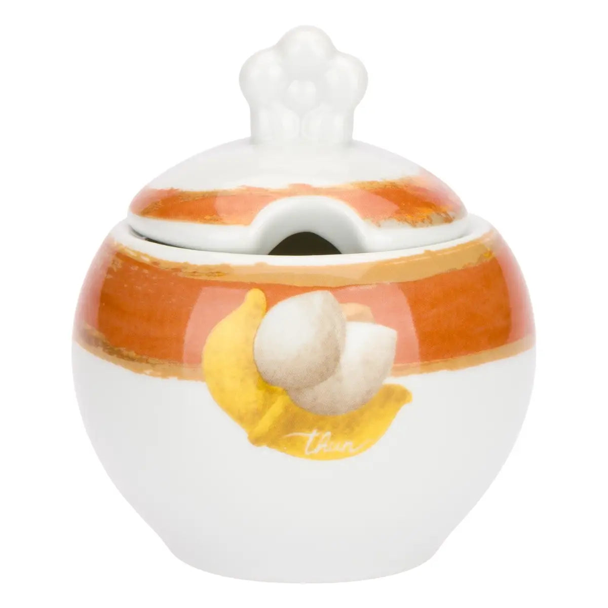 La Zuccheriera con Cucchiaio Tulipani è un elegante accessorio in porcellana bianca decorato con pennellate ambra e un tulipano in rilievo dalle foglie dorate. Il set include un pratico cucchiaino coordinato con la scritta "caffè al volo", rendendolo un complemento d'arredo funzionale e una perfetta idea regalo per amanti del design floreale.