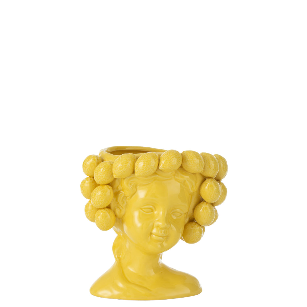 Portavaso in ceramica gialla lucida a forma di testa di ragazza, i cui capelli sono rivestiti da limoni in rilievo disposte su più file. Complemento d'arredo dal design fantasioso firmato Jolipa, ideale come vaso decorativo o idea regalo originale per la casa.